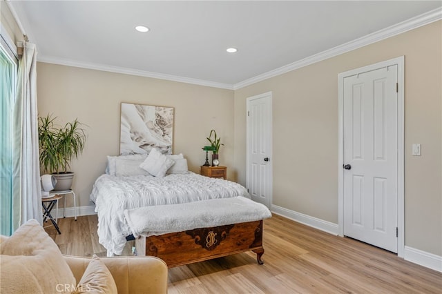 bedroom featuring light wood-type flooring and ornamental molding