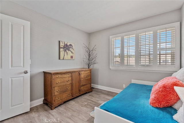 bedroom with light hardwood / wood-style floors