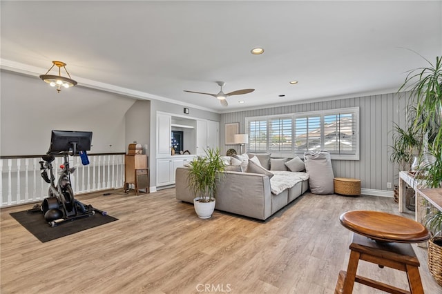 living room with light hardwood / wood-style floors and ceiling fan