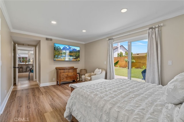 bedroom featuring access to outside, light hardwood / wood-style floors, and ornamental molding