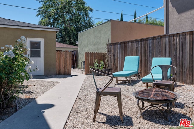 view of patio with an outdoor fire pit