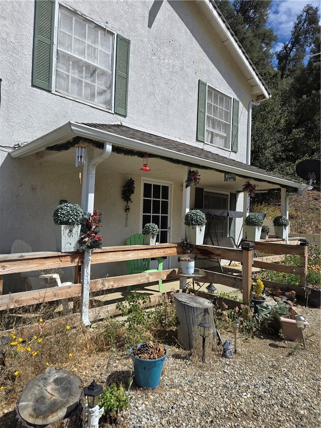 doorway to property with covered porch