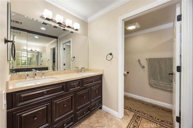 bathroom with crown molding, tile patterned flooring, and vanity