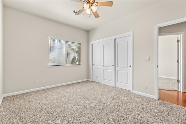 unfurnished bedroom featuring a closet, ceiling fan, and carpet floors