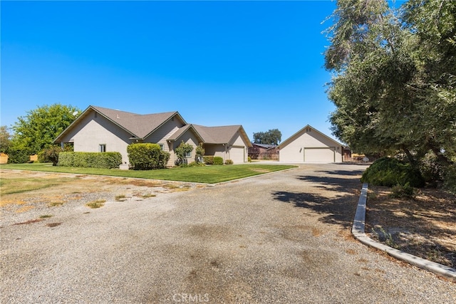 view of front of home featuring a front yard and a garage