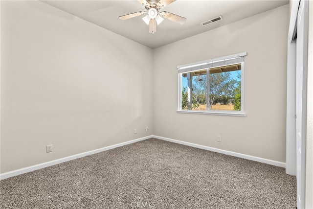 carpeted empty room with ceiling fan