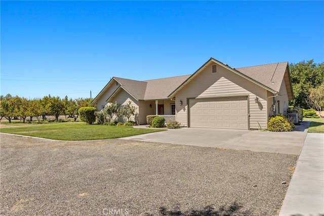 ranch-style home featuring a front lawn and a garage