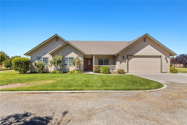 ranch-style home featuring a front yard and a garage