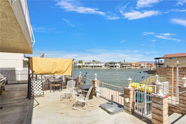 view of patio / terrace featuring a water view