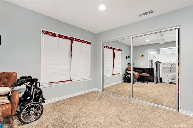 carpeted bedroom featuring a closet