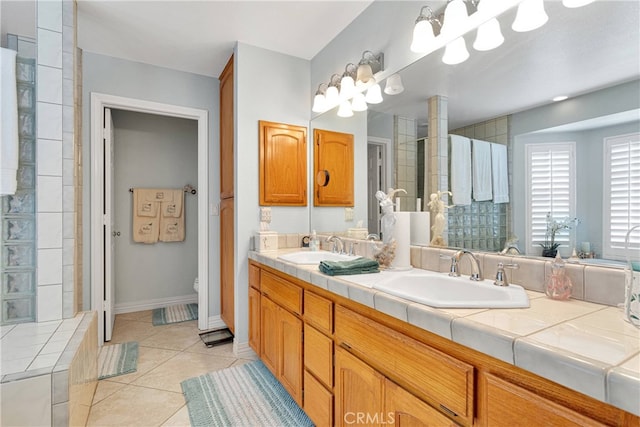 bathroom featuring tile patterned flooring, toilet, and vanity