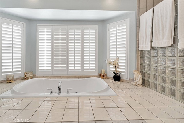 bathroom featuring tiled tub