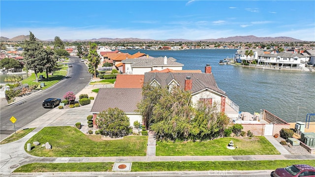 aerial view featuring a water and mountain view