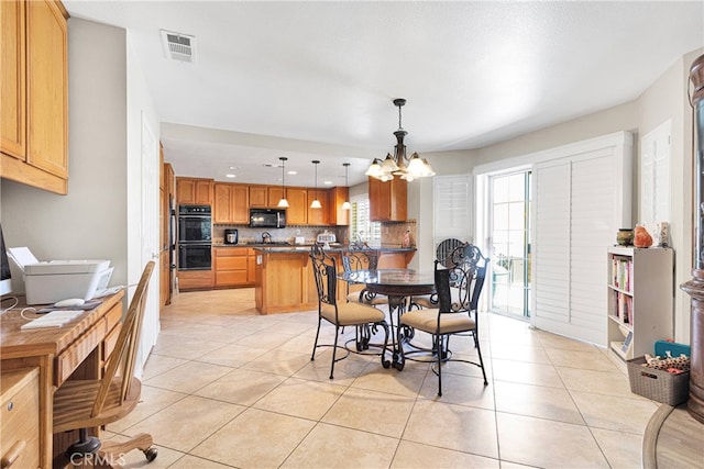 dining room featuring light tile patterned flooring and a chandelier