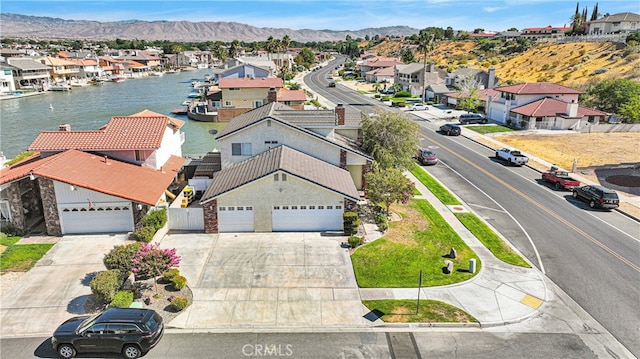 birds eye view of property with a mountain view