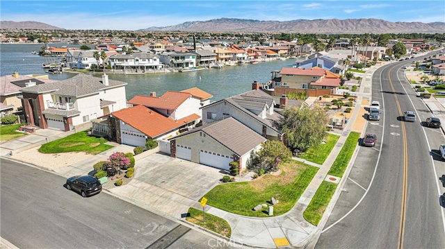 birds eye view of property with a mountain view