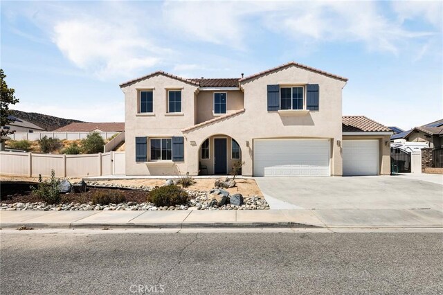 mediterranean / spanish-style house featuring a garage