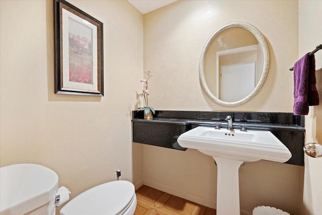 bathroom with tile patterned floors and toilet