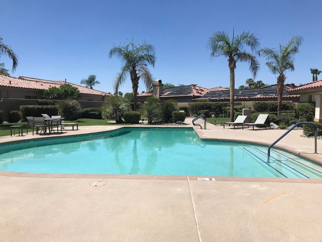 view of swimming pool with a patio