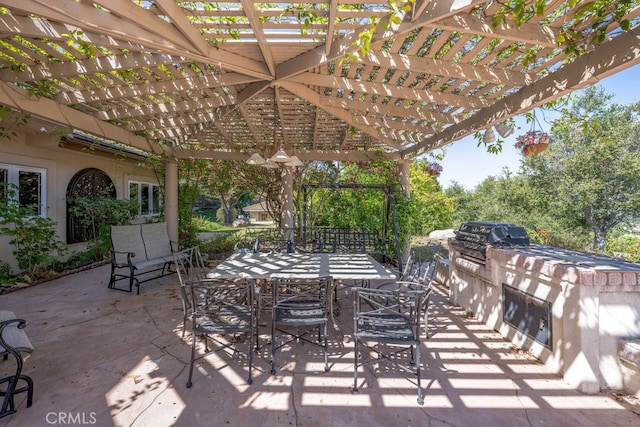 view of patio featuring area for grilling, a pergola, and grilling area