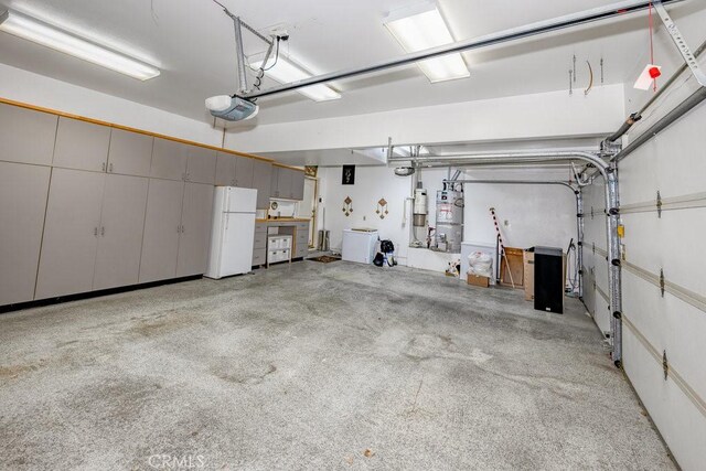 garage with white refrigerator and a garage door opener