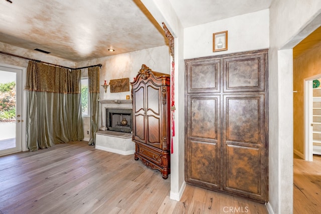 unfurnished living room featuring light hardwood / wood-style floors