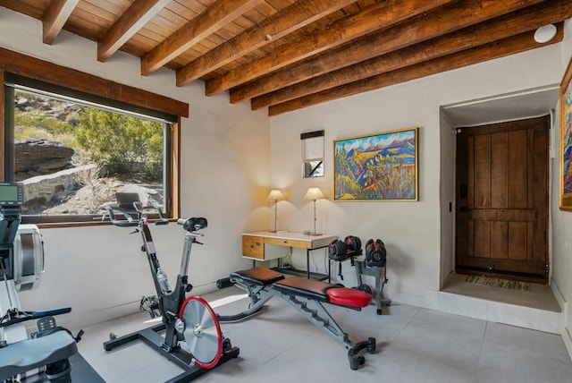 workout area with tile patterned flooring and wooden ceiling