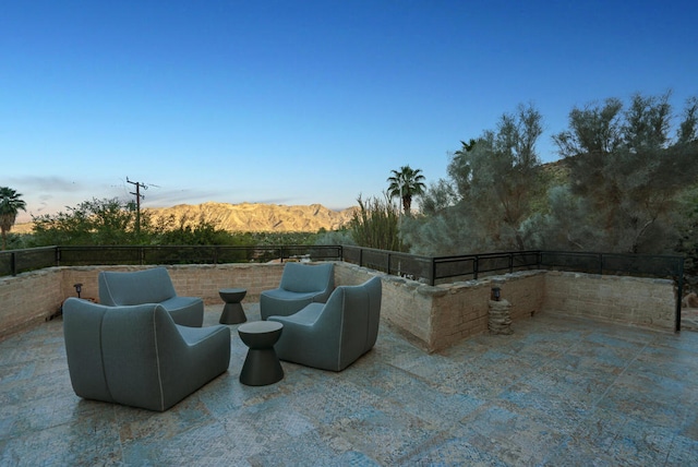 view of patio / terrace featuring a mountain view