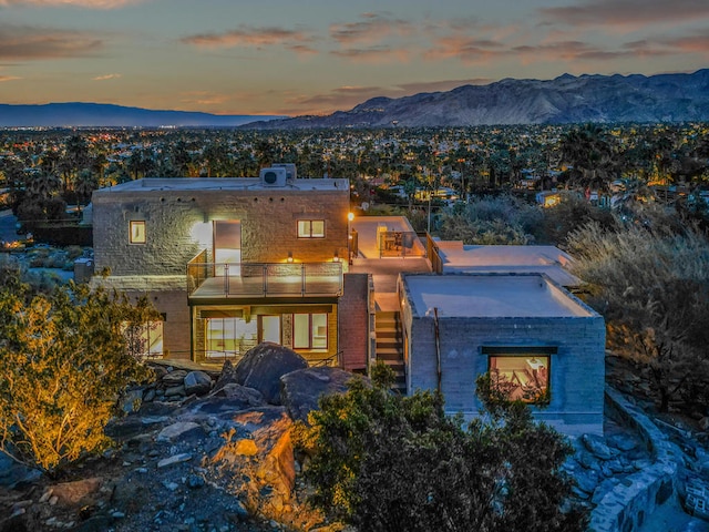 contemporary house with a balcony and a mountain view