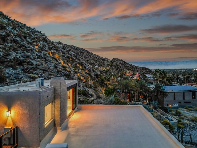 patio terrace at dusk with a mountain view