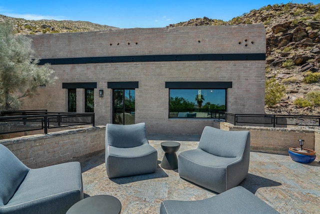 exterior space featuring an outdoor living space and a mountain view