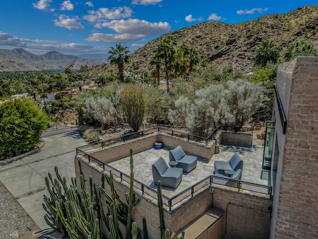 view of patio / terrace featuring outdoor lounge area and a mountain view