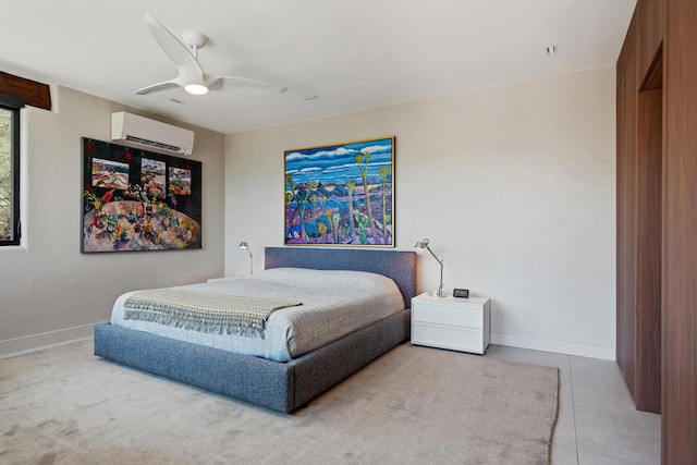 bedroom featuring ceiling fan, light tile patterned floors, and an AC wall unit