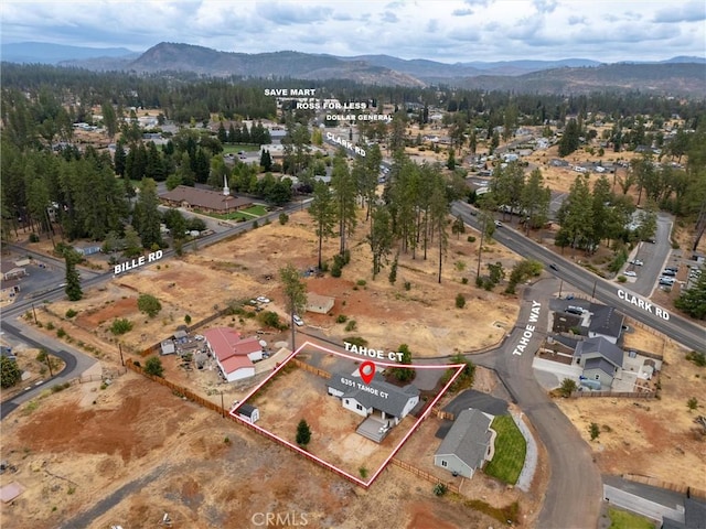 birds eye view of property featuring a mountain view