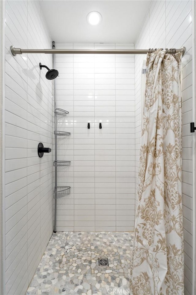 bathroom with curtained shower