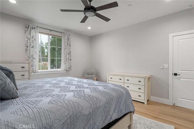 bedroom featuring ceiling fan and light wood-type flooring