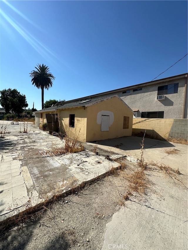 view of side of home with a patio