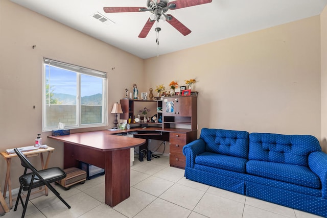 tiled office space with ceiling fan