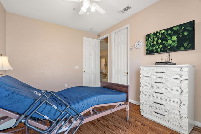 bedroom with ceiling fan and hardwood / wood-style floors