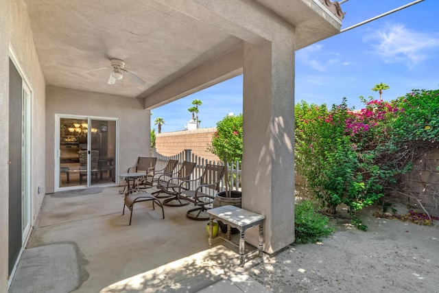 view of patio featuring ceiling fan