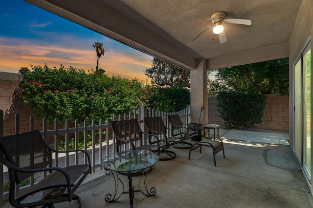 patio terrace at dusk with ceiling fan