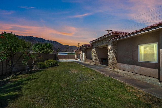 yard at dusk with a mountain view