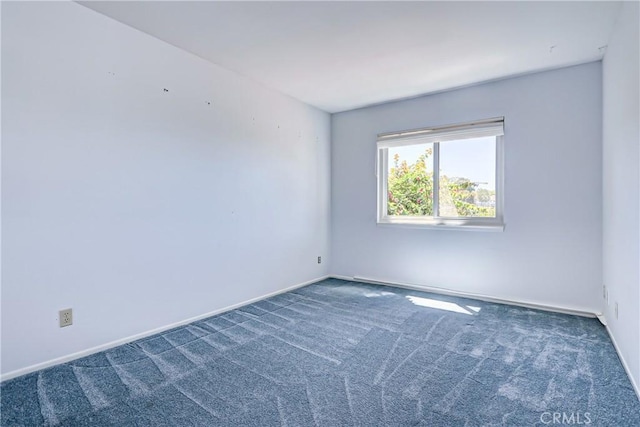 empty room with dark carpet