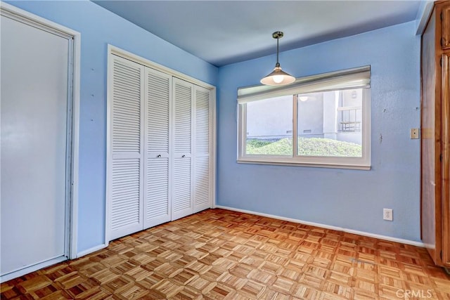 unfurnished bedroom featuring light parquet floors