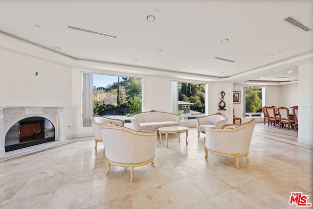 living room featuring a premium fireplace