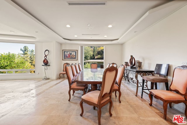 dining room featuring a tray ceiling