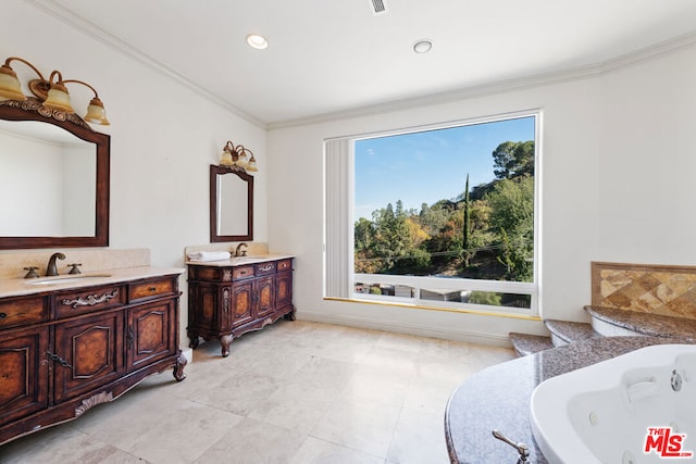 bathroom featuring a bath, ornamental molding, vanity, and a wealth of natural light