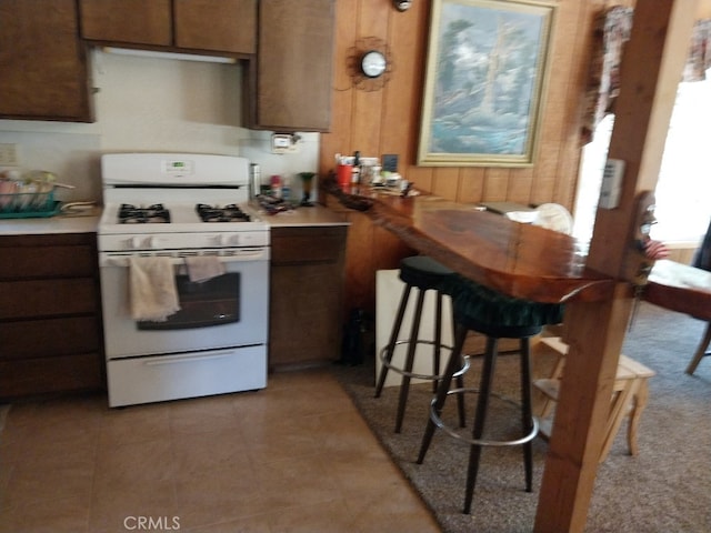 kitchen with white range with gas cooktop