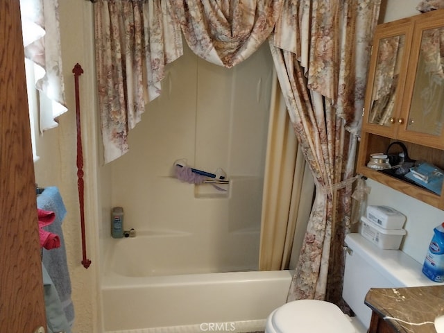 full bathroom featuring shower / tub combo, vanity, and toilet