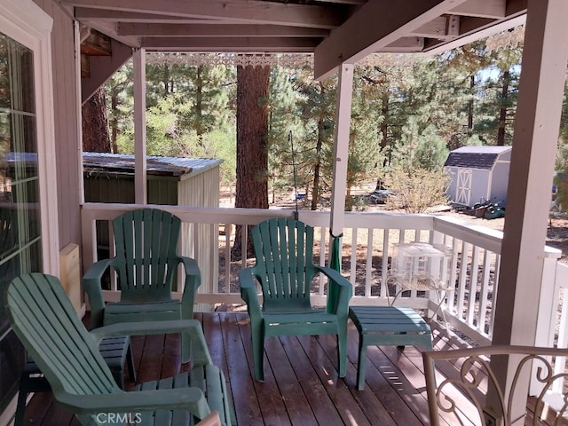 deck featuring a shed